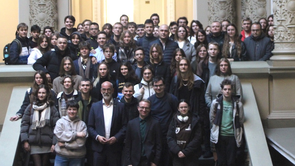 Group of people in a historic stairwell