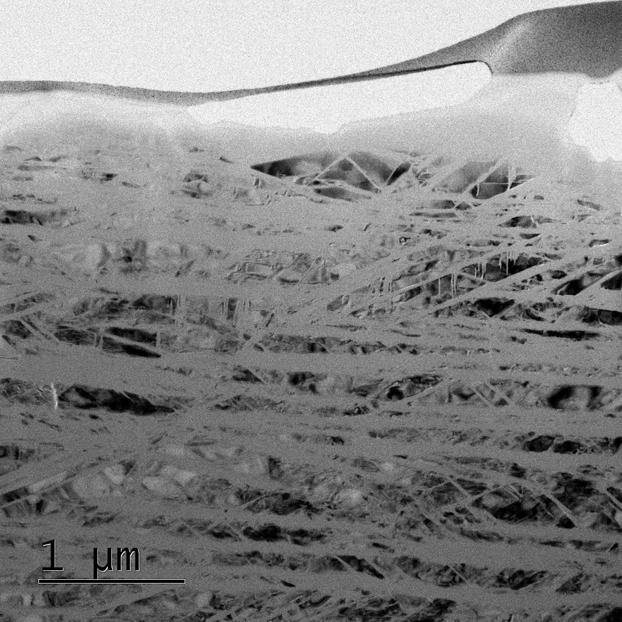 Microscopic image of glass lamellae in quartz crystals Microscopic image of glass lamellae in quartz crystals