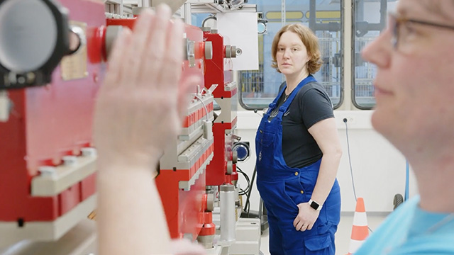 Jana Barker, engineer at DESY, and a colleague check the accelerator's magnets.